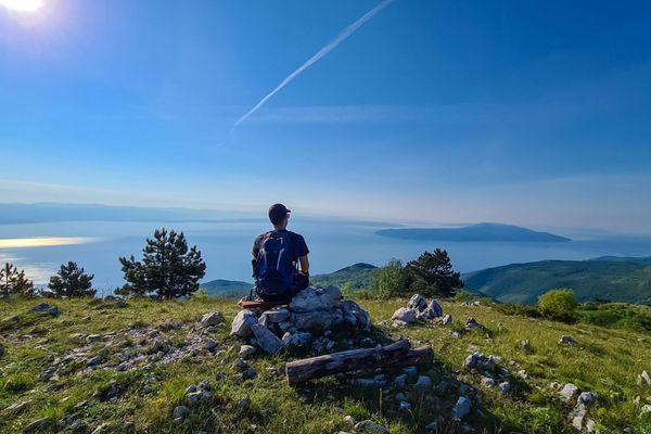 Hiker at Vojak Lookout overlooking the Istrian coast and islands